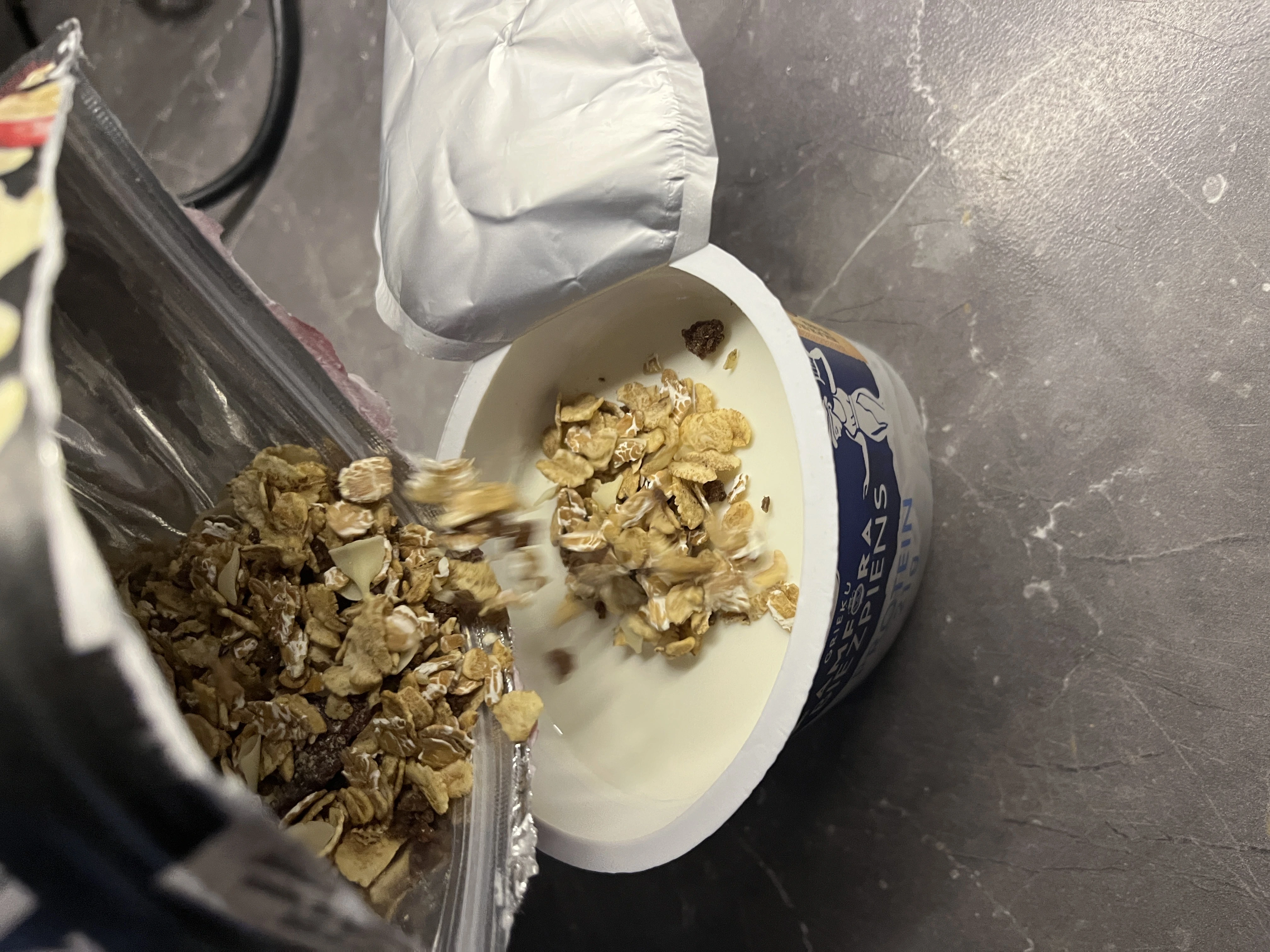 Bag of muesli being poured into a bowl